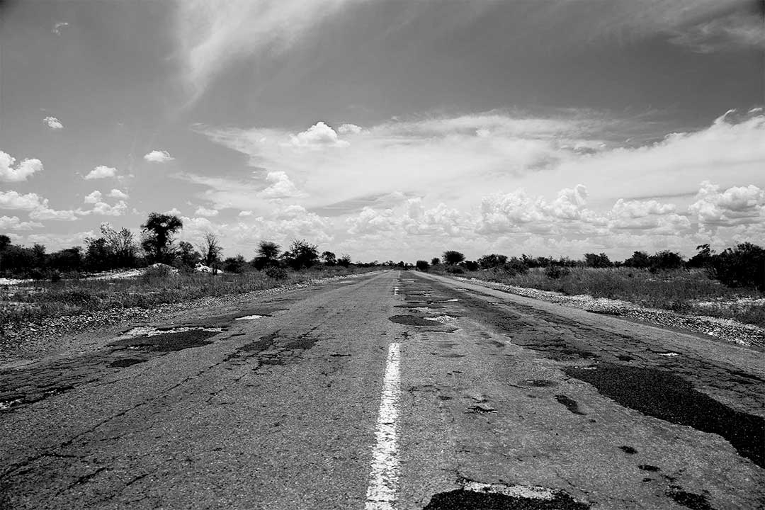 "The Road No More" - A photograph of the old 2 lane A3 north to Zambia from Gaborone, Botswana, Africa. A B&W photograph by Annelize Bester